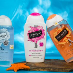 Bright and lively shot of three Femfresh bathing products against a blue watery background.